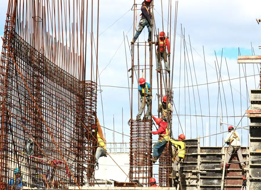 Construction teams working on a reinforced concrete structure
